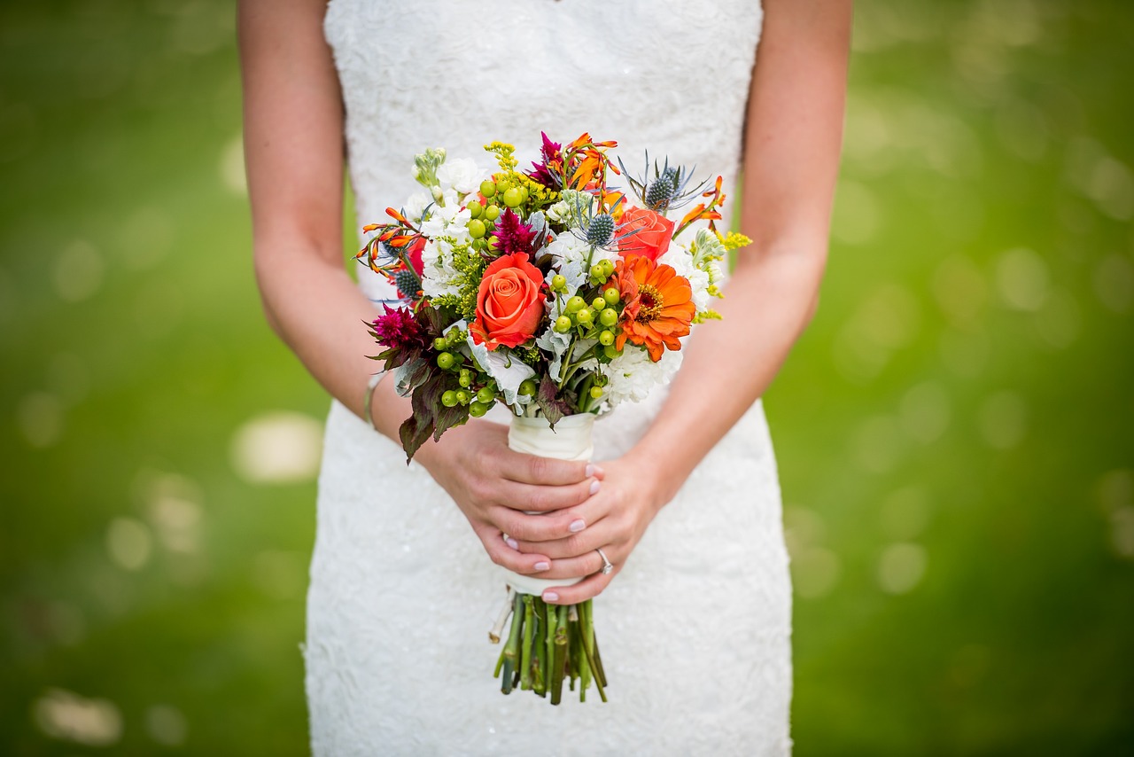 bride holding colorful bouquet